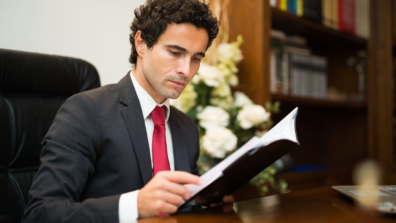 Funeral director reading book